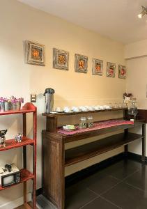 a room with a counter with dishes on it at Wakapunku Boutique B&B in Cusco