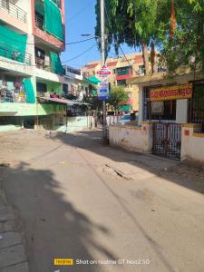 an empty street in a city with a building at Uma's Homestay in Gwalior +2 photos