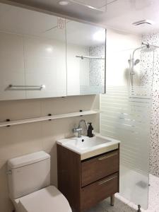 a bathroom with a toilet and a sink and a shower at Summer's House in Jeju +18 photos