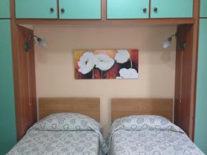 Voodi või voodid majutusasutuse D'Ambrogio Guest House toas
