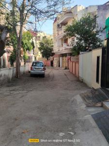 a car parked on the side of a street at Uma's Homestay in Gwalior