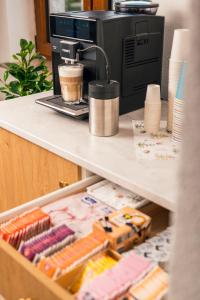 a drawer in a counter with a coffee maker at Next Lap - Rooms in Quiddelbach +31 photos