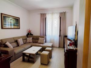 a living room with a couch and a table at Casa della Fiera 9 in Narni