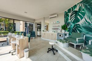 an office with a palm tree mural on the wall at Ballito Hills 830 in Ballito