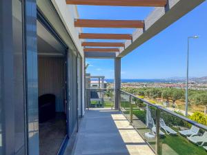 a balcony of a house with a view at Villa Elite in Kuşadası +17 photos