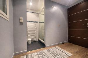 a bathroom with a shower and a glass door at Suite Notre Dame - Appartements in Cannes +58 photos