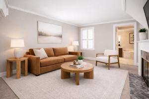 a living room with a couch and a table at The Manchester View in Manchester