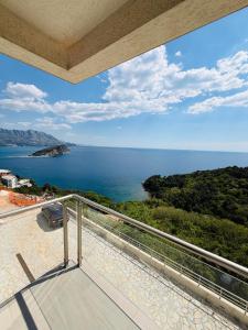 a balcony with a view of the ocean at Romantic Hillside Escape Sea View in Budva