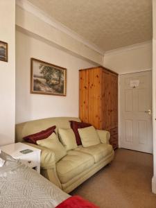a living room with a couch and a bed at Littlebeck in Danby