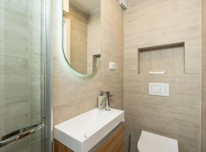 a bathroom with a sink and a mirror at Villa Jele in Dubrovnik +40 photos