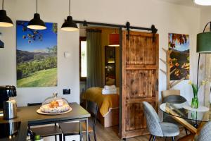 a room with a bed and a wooden door at Matilde House in Fanano