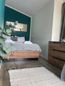 a bedroom with a bed and a mirror at Luna's Sea View & City Center Apartment in Alexandroupoli +9 photos