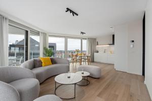 a living room with a couch and a table at Baldus 0401 P47 in Sint-Idesbald