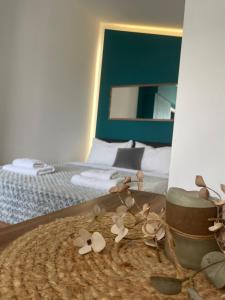 a bunch of flowers on a table in a bedroom at Luna's Sea View & City Center Apartment in Alexandroupoli