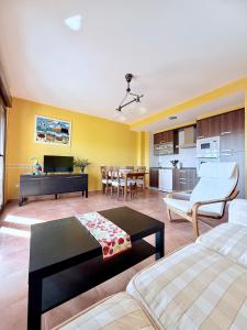 a living room with a couch and a table at CASA DE AREAS in Sanxenxo