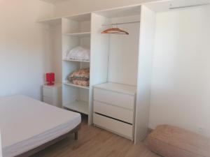 a bedroom with a bed and a closet at Gîte d'étape Chez Isa in Vers