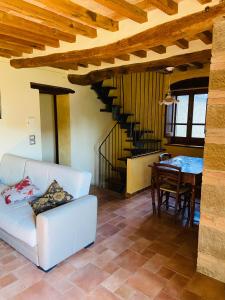a living room with a couch and a table at Agriturismo Del Casato in Sansepolcro +30 photos