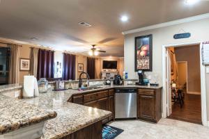 a kitchen with a sink and a counter top at Osile Villa in DeSoto