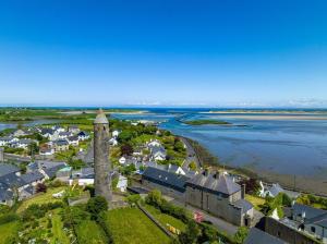 an aerial view of a small town with a clock tower at The C & A Studio in Killala