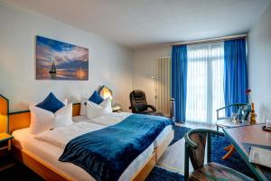 Postel nebo postele na pokoji v ubytování Paulin Hotel Trier
