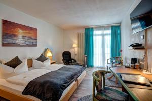 Postel nebo postele na pokoji v ubytování Paulin Hotel Trier