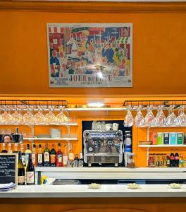 a counter in a restaurant with a bar with alcohol at L eau douce in Ménétréol-sous-Sancerre +90 photos