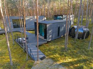 an aerial view of a tiny house in the woods at Relax al Mare with sauna near the sea in Laulasmaa