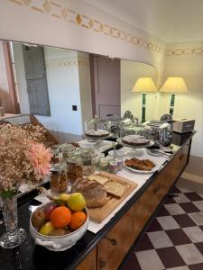 a buffet of food on a counter in a room at Casa Tarabuso B&B in Reggio Emilia