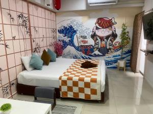a room with a bed and a painting on the wall at 48 Ville Donmuang Airport in Bangkok +75 photos