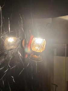 a couple of lights hanging from a ceiling at Sneferu hotel pyramids View in Cairo