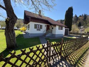 a house with a fence in front of it at Bergliebe in Weitnau