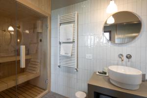 a bathroom with a sink and a mirror at Vigne del Malina - Agriturismo & Winery in Orzano +32 photos