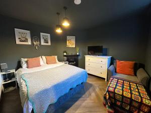 a bedroom with a bed and a dresser at Comfortable Room or Whole House - 4BR 1BATH 1TOILET at Suffolk Pink House, Newmarket in Newmarket