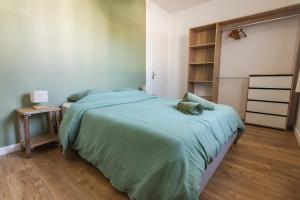 a bedroom with a bed and a book shelf at Maison avec parking la Flocellière in La Flocellière