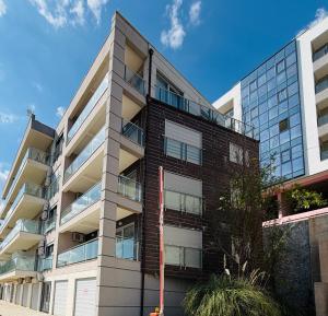 a tall apartment building with a building at Nature Escape Amazing Sea View in Budva