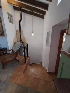 a living room with a woodburning stove in the wall at The Retreat in Las Encebras