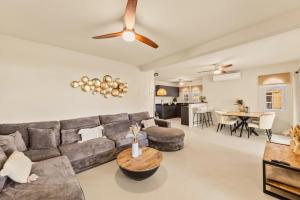 a living room with a couch and a table at Marina Apartment A2, luxury waterfront apartment Spanish Water, Jan Thiel, Curaçao in Jan Thiel