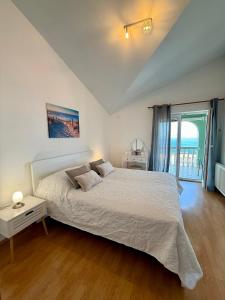 a bedroom with a bed and a large window at Holiday Home Larma in Senj +121 photos