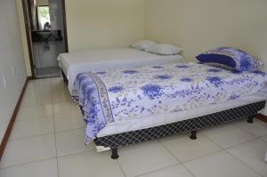 En eller flere senge i et værelse på Pousada Mirantes Do Sincorá