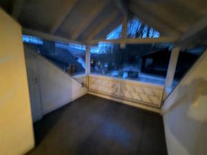 a view of an empty room with a balcony at Monteure Maisonette in Eggingen