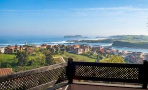 a view of the ocean from a balcony at Hotel Montañés in Suances