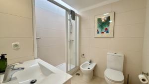 a bathroom with a sink and a toilet and a shower at Golfe - Shared Pool - 7 Pax - Vilamoura in Vilamoura