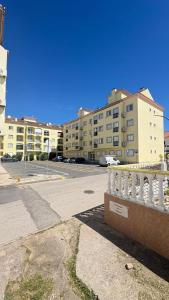 an empty street in a city with a building at Monte Gordo T1 - Estrela do Mar in Monte Gordo