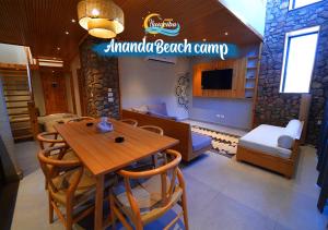 a restaurant with a table and chairs in a room at Ananda Beach Camp in Nuweiba