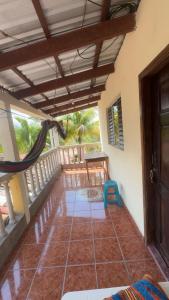 a room with a balcony with a table and a chair at Accommodation in Copán Ruinas #6 in Copán Ruinas