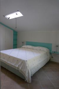 a bedroom with a large bed in a room at Nosside & Saffo Guesthouse in Amantea