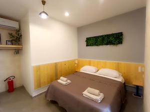 a bedroom with a bed with two towels on it at Minuetto 60 in Ostuni