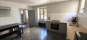 a kitchen with a sink and a counter top at 16 Chemin De Compostelle in Sénergues +21 photos
