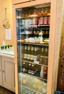 a refrigerator filled with lots of different types of food at Frühstückspension Waldeck in Mayrhofen +87 photos