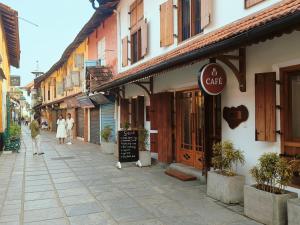 a street with people walking down a street at Ezekiel House Residence in Cochin